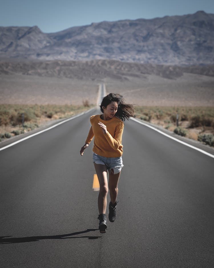 Photo Of Woman Running On Road