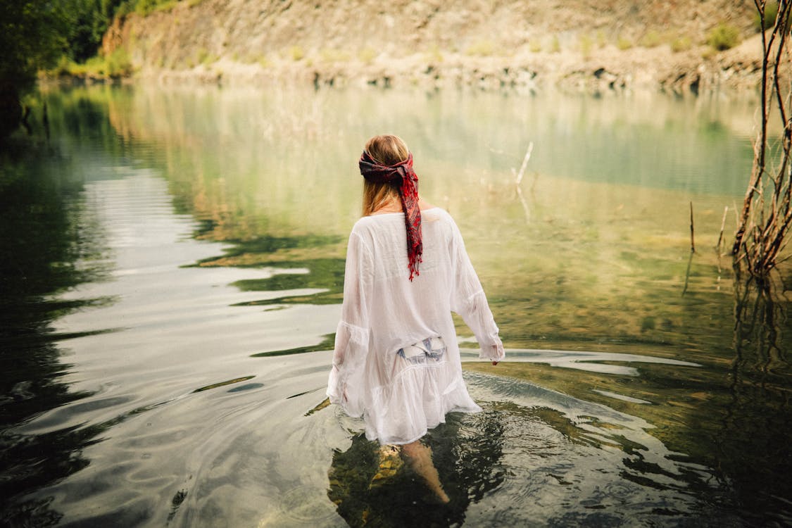 Free Woman Walking on Body of Water Stock Photo
