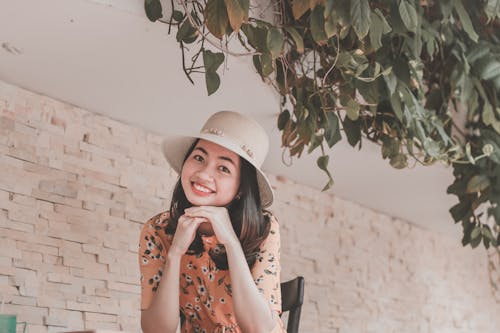 Free Smiling Woman Sitting Beside A Tree Stock Photo