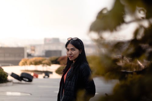 Selective Focus Side View Photo of Standing Woman Posing