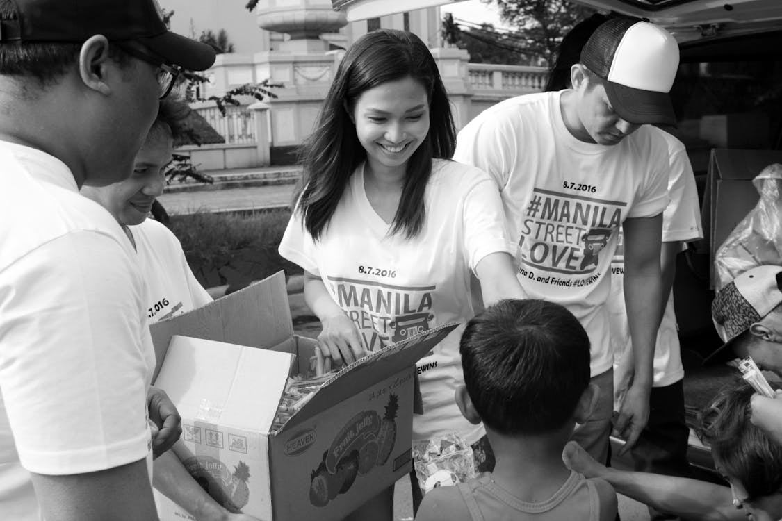 People Holding Boxes