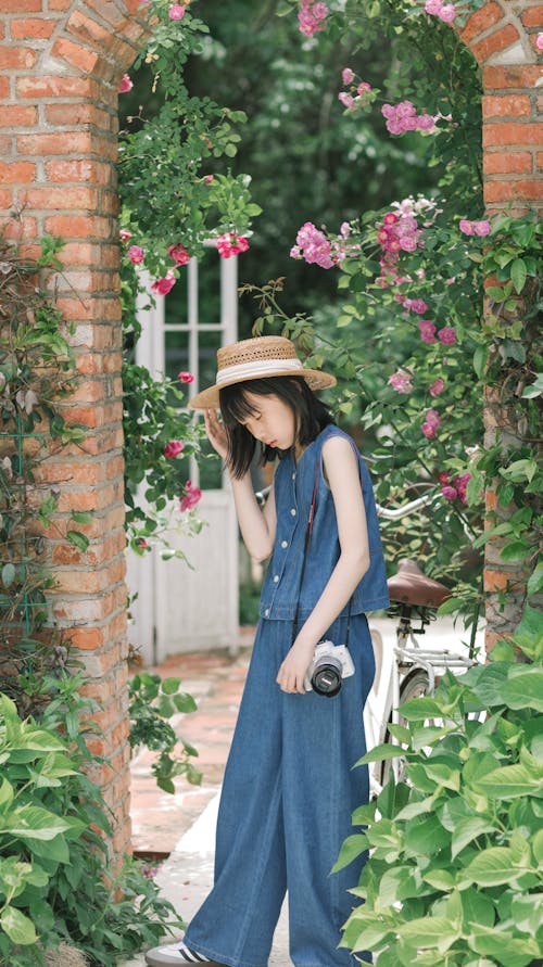 Woman in Hat in Garden