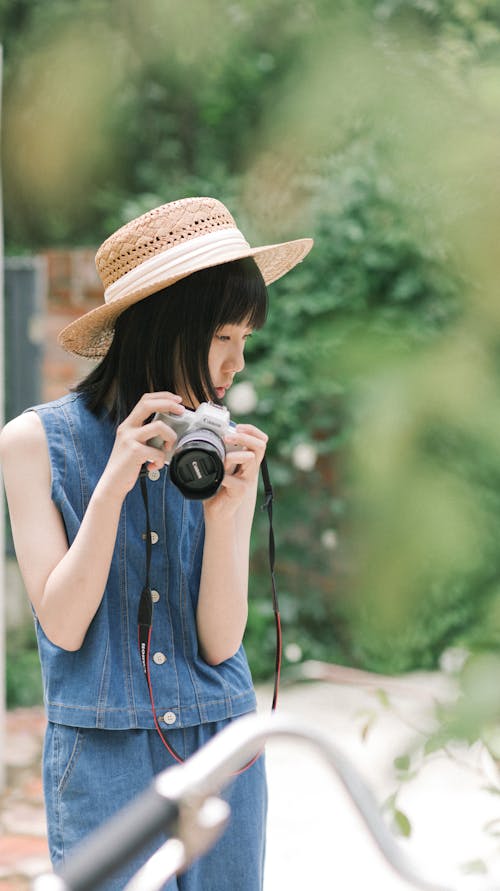 Portrait of Woman in Hat and with Camera