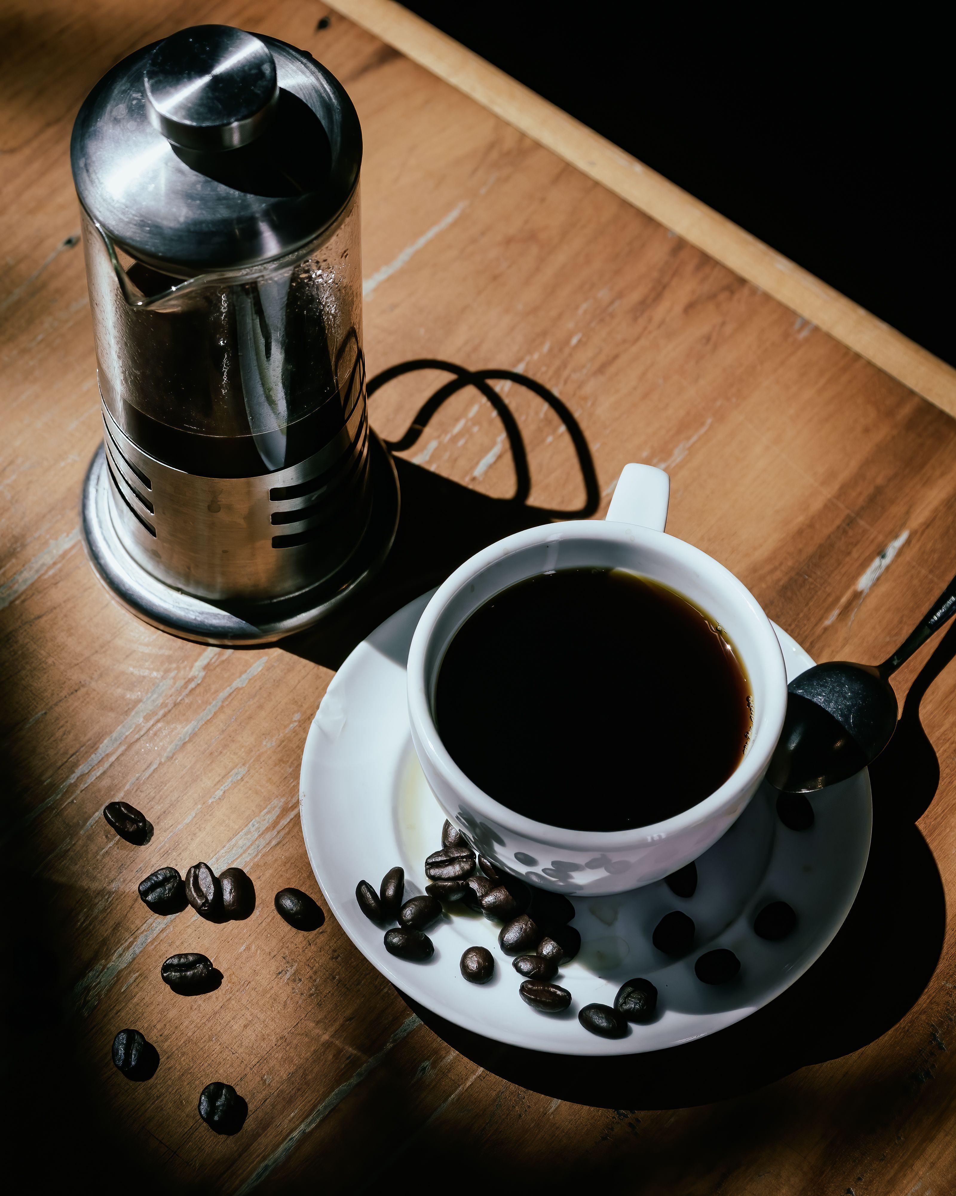 coffee-beans-beside-coffee-press-and-glass-cup-free-stock-photo