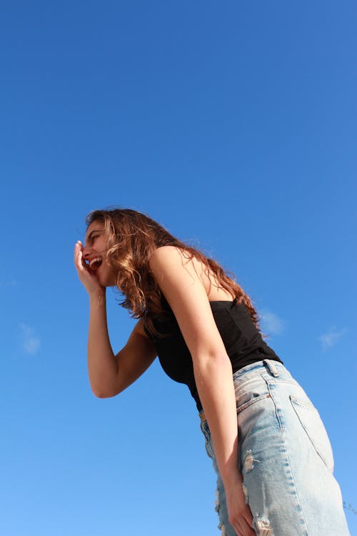 Low Angle Photo of Laughing Woman