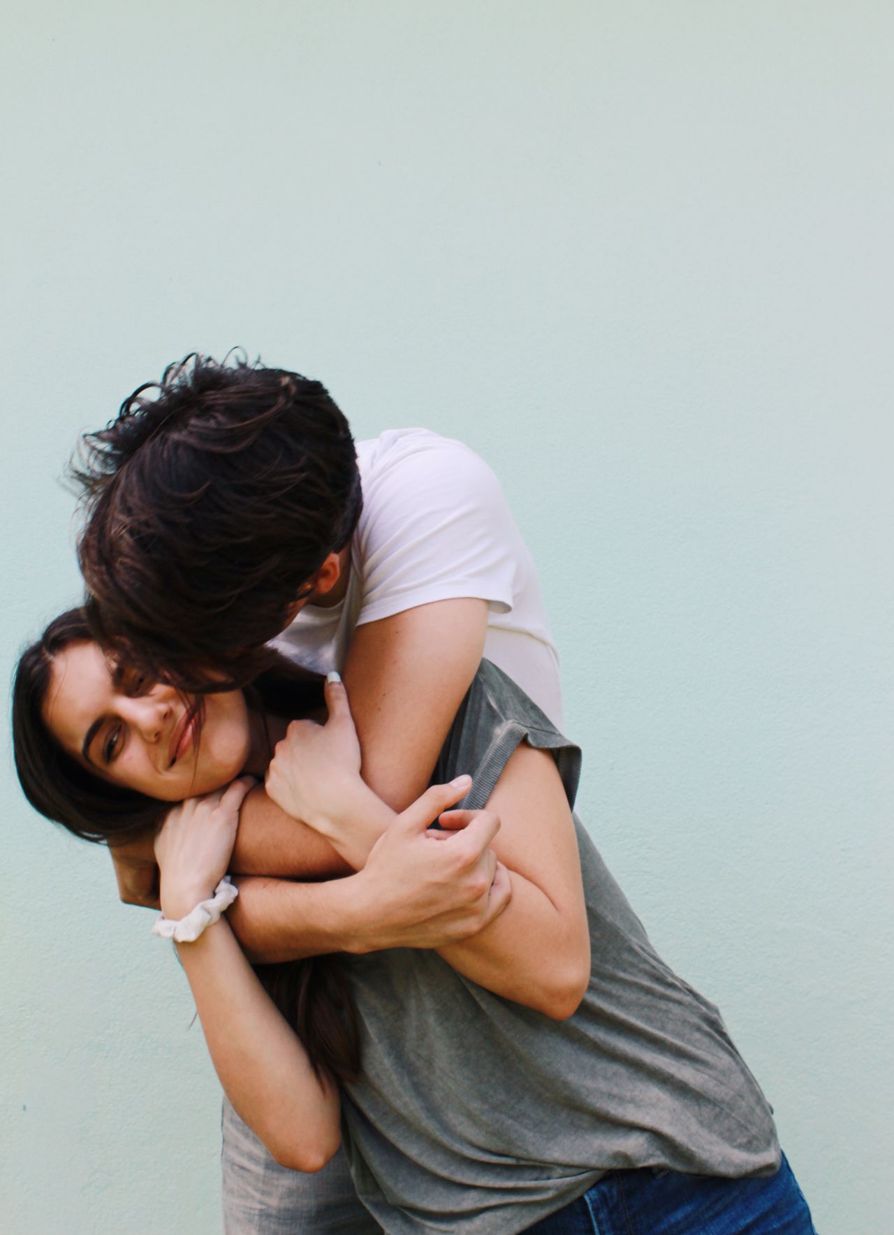 A loving couple shares a joyful embrace