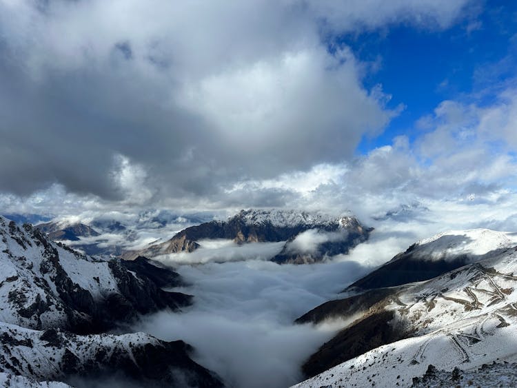 Cloud Over Mountains In Snow