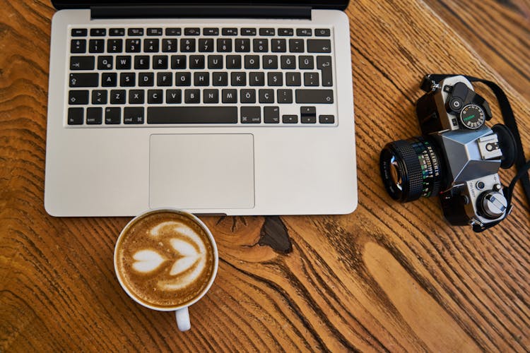 Top View Photo Of Laptop Near Camera