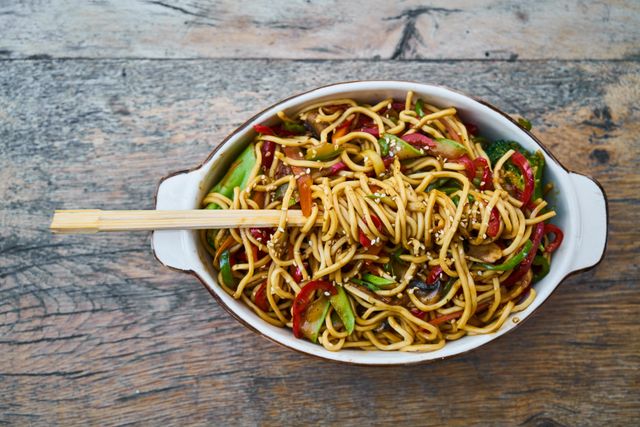 Noodle bowl flatlay with chopsticks