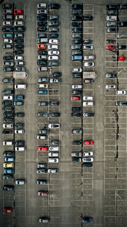Aerial view of parking lot with cars