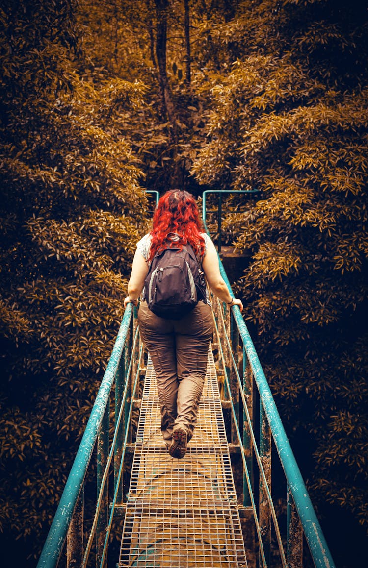 Woman Walking On Bridge