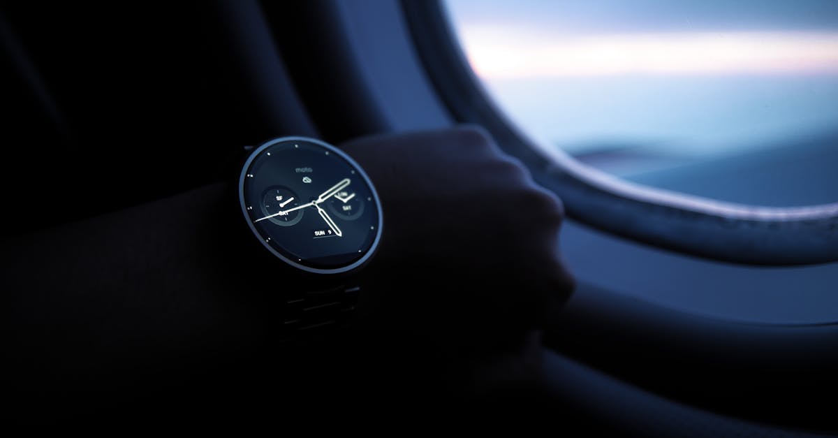 Smartwatch displaying time and weather features, worn by a person near an airplane window, highlighting travel tech and wearable devices.