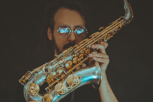 Musician with sunglasses performing jazz on a saxophone, creating a soulful vibe.