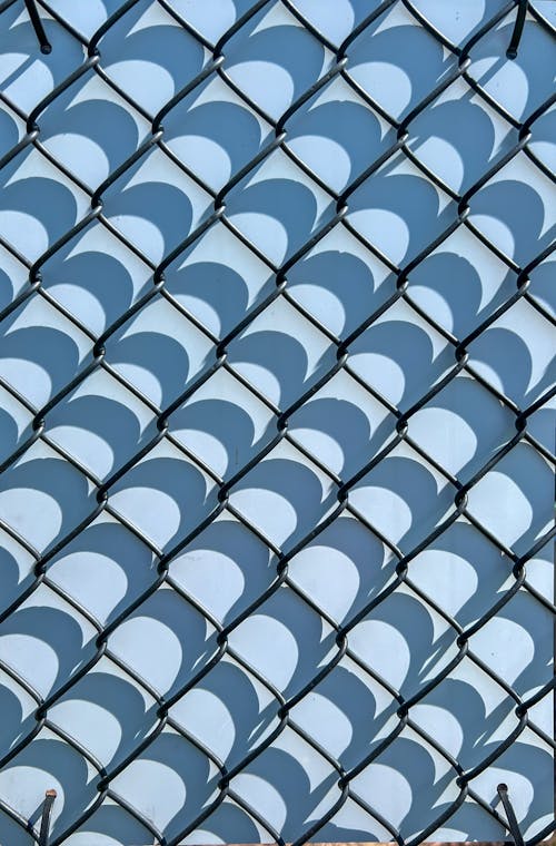 A fence with a blue and white pattern