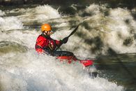 Man on Red Watercraft