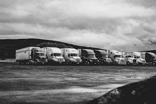 Free Parked Trucks Under Clouds Stock Photo
