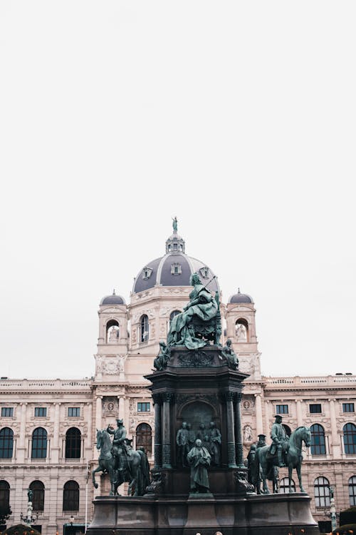 A statue of a horse in front of a building