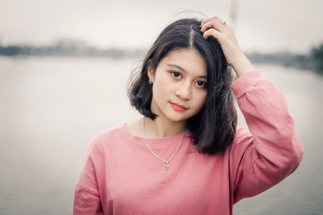 Free Photo of Girl Wearing Pink Sweater Stock Photo