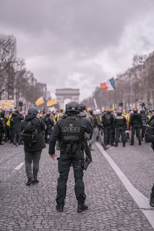 Man Wearing Black Vest Near Crowded People