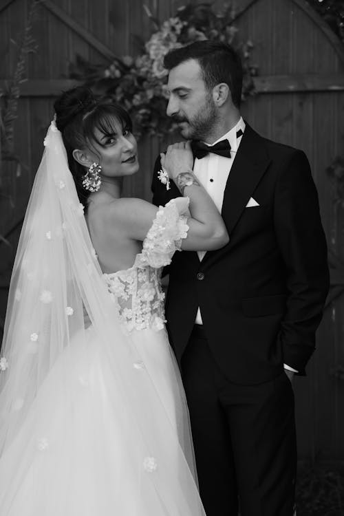 A black and white photo of a bride and groom