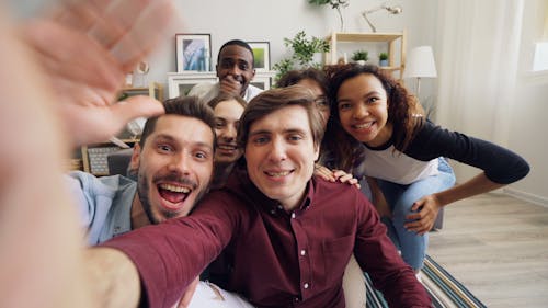 A group of people taking a selfie together