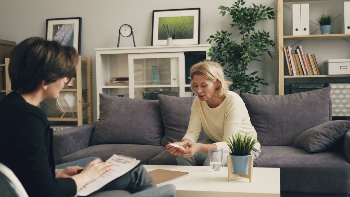 Therapist and adult client talking during an individual therapy session