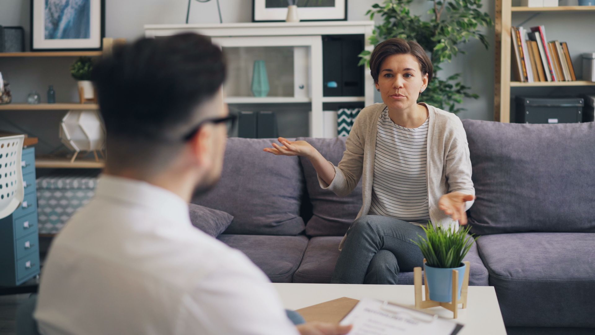 Client consulting with a professional coach in a warm, modern office