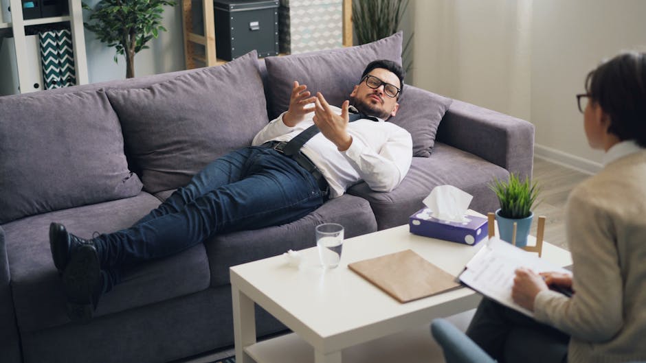 Person meeting with counselor in comfortable office setting discussing treatment options - alcoholics rehab near me Person meeting with counselor in comfortable office setting discussing treatment options - alcoholics rehab near me