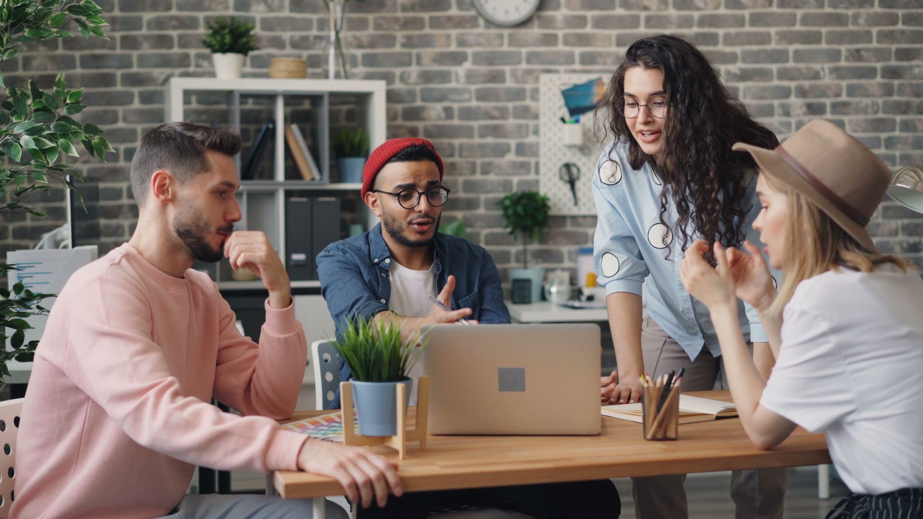 Diverse group of coworkers working together in a stylish office setting.
