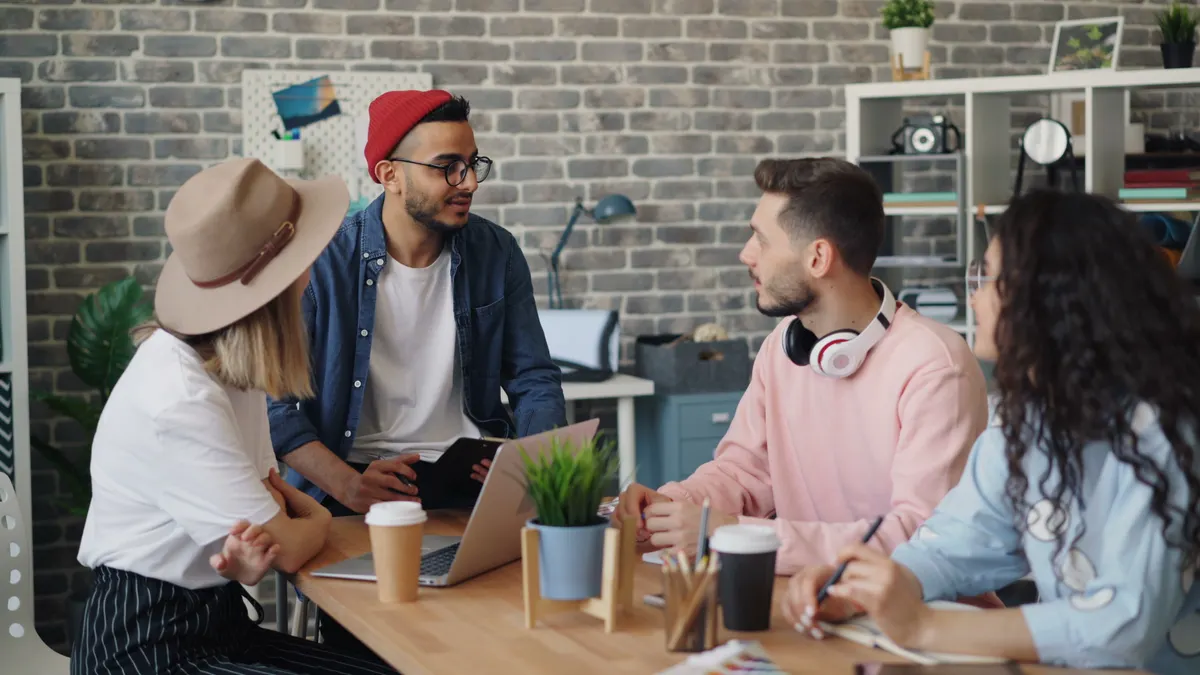 A creative team discussing editorial oversight in AI to ensure content quality assurance and fact checking.