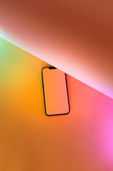 Minimalist smartphone mockup with vibrant gradient background and ample copy space.