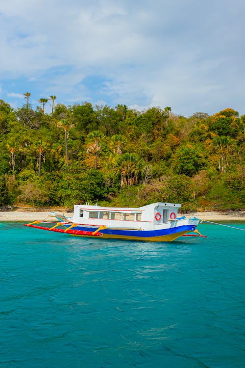 A boat is docked in the middle of the ocean