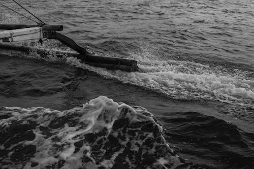 A black and white photo of a boat in the water