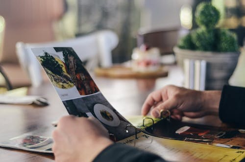 Free Person Holding Magazine Stock Photo