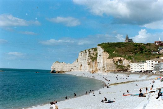 Explore the stunning cliffs and serene beach at Etretat, Normandy, France, perfect for leisure and sightseeing.