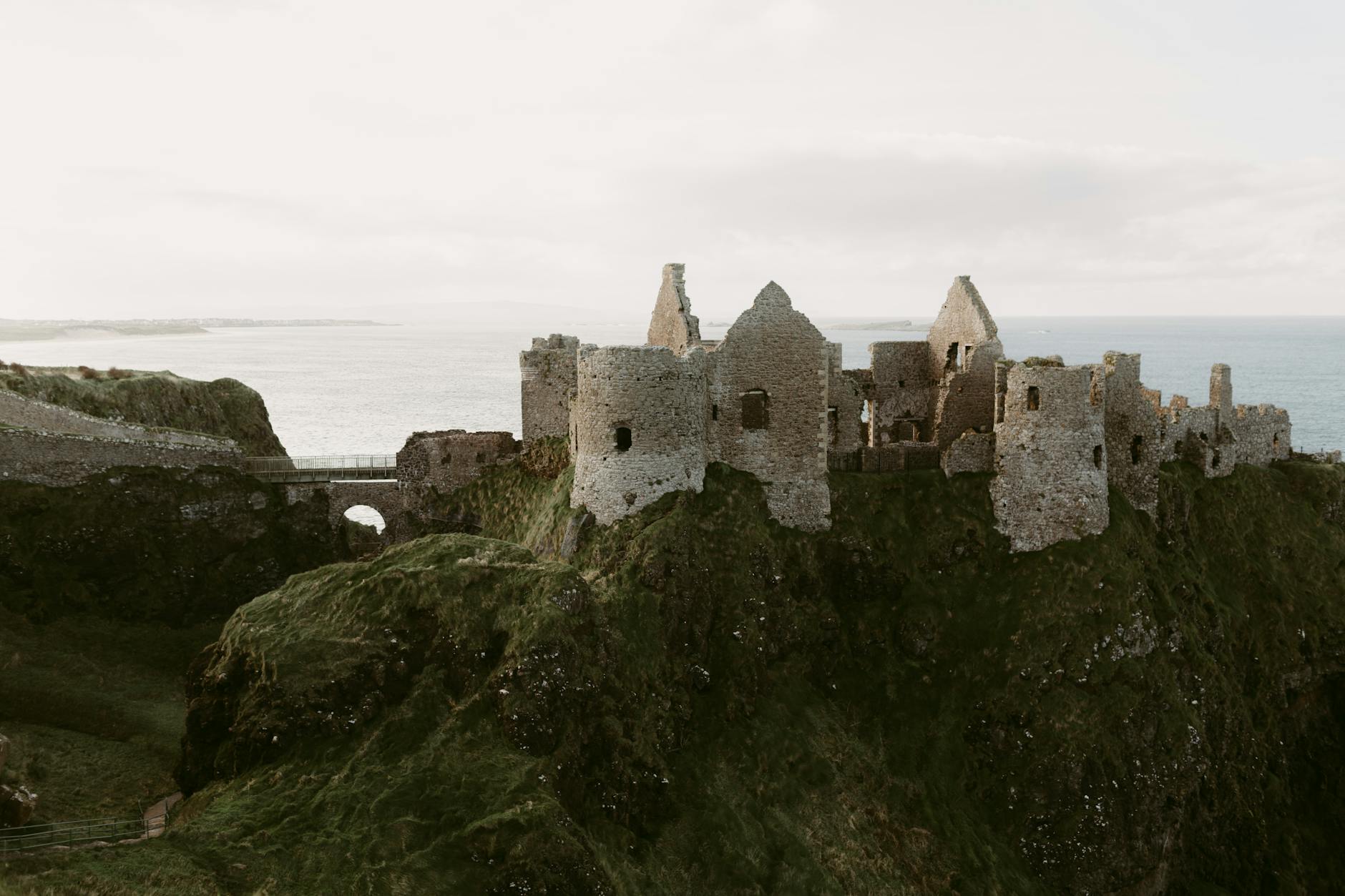 old medieval ruins of Dunluce Castle on ocean coast in northern Ireland