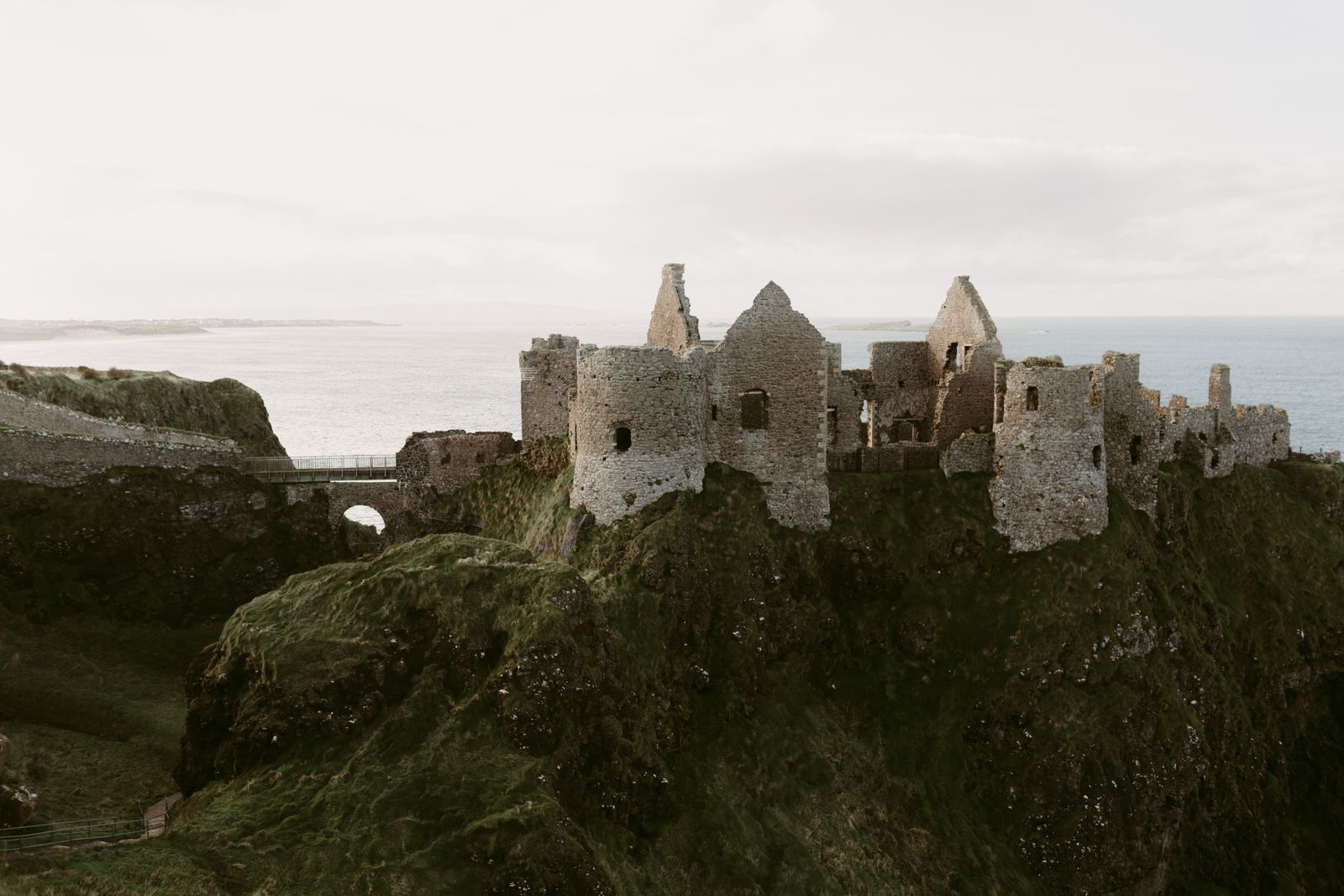The ruins of Dunluce Castle above the sea