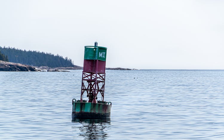 Green Bouy On Ocean