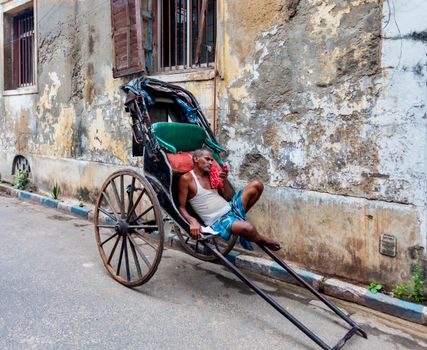 Man Sitting on a Trolley