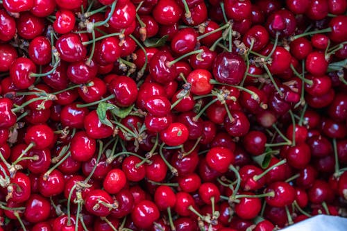 A close up of cherries in a bowl