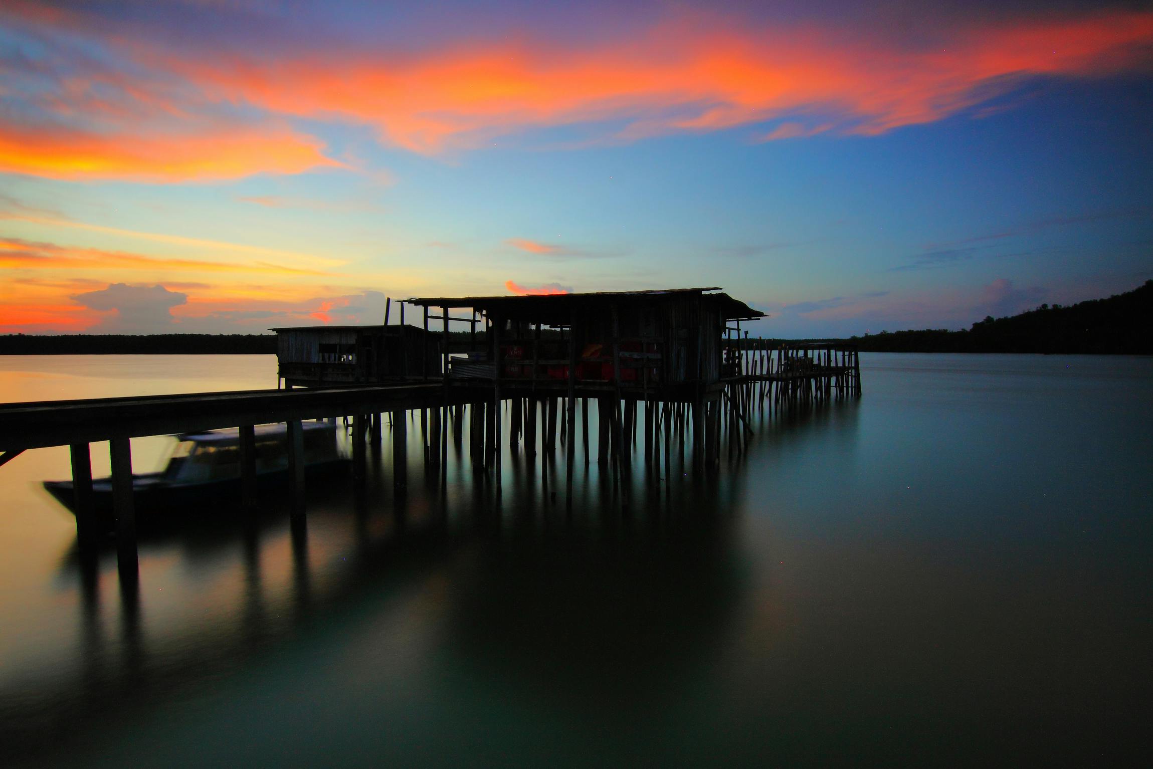 brown wooden house on top of sea