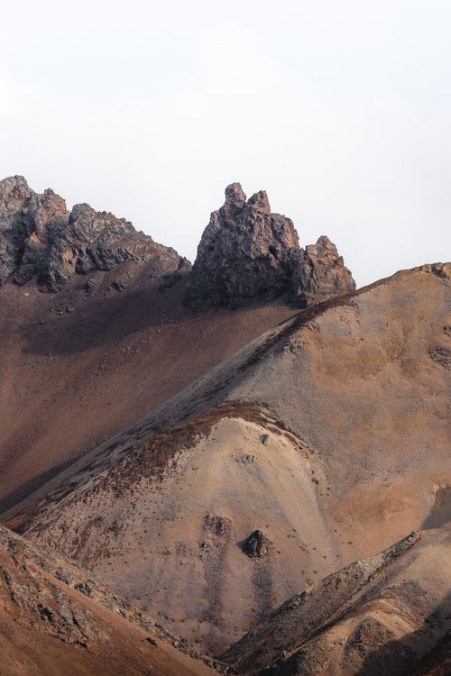Free Captivating view of eroded mountains showcasing barren rocky terrain. Stock Photo