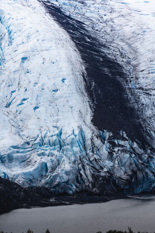 Free Stunning view of a glacier melting into a lake, showcasing climate change effects. Stock Photo