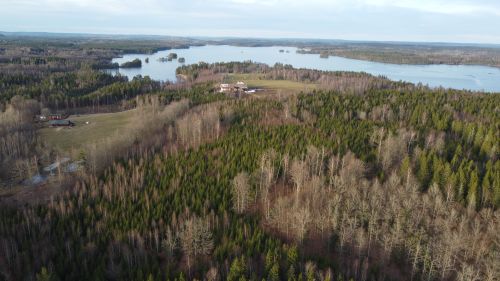 Free A stunning aerial view of a forest and lake landscape in Kronoberg County, Sweden. Stock Photo