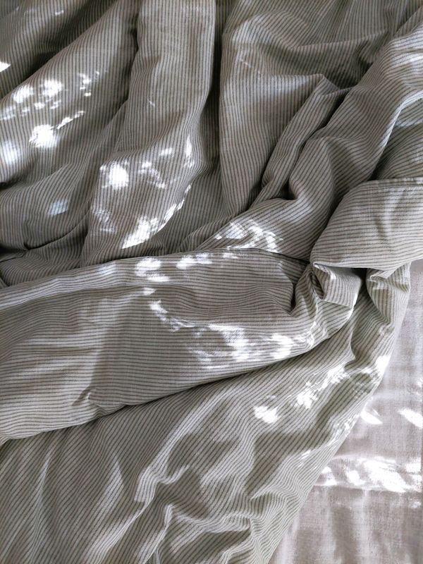 Wrinkled linen with dappled sunlight — C on Pexels