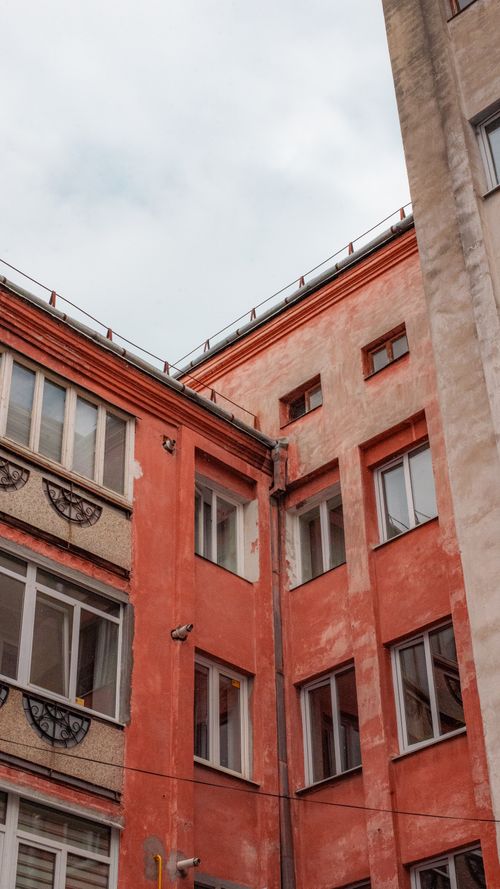 Free Old residential building with red walls in Ivano-Frankivsk, Ukraine. Stock Photo