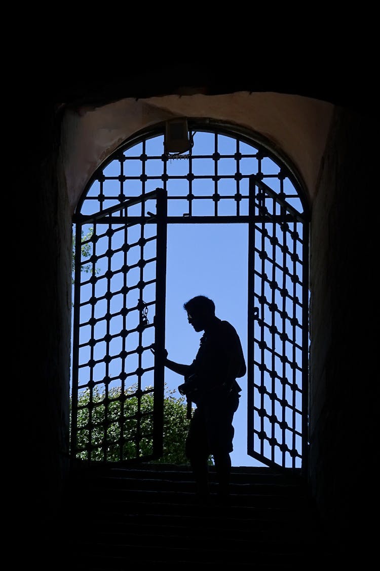 Silhouette Of Man In Window