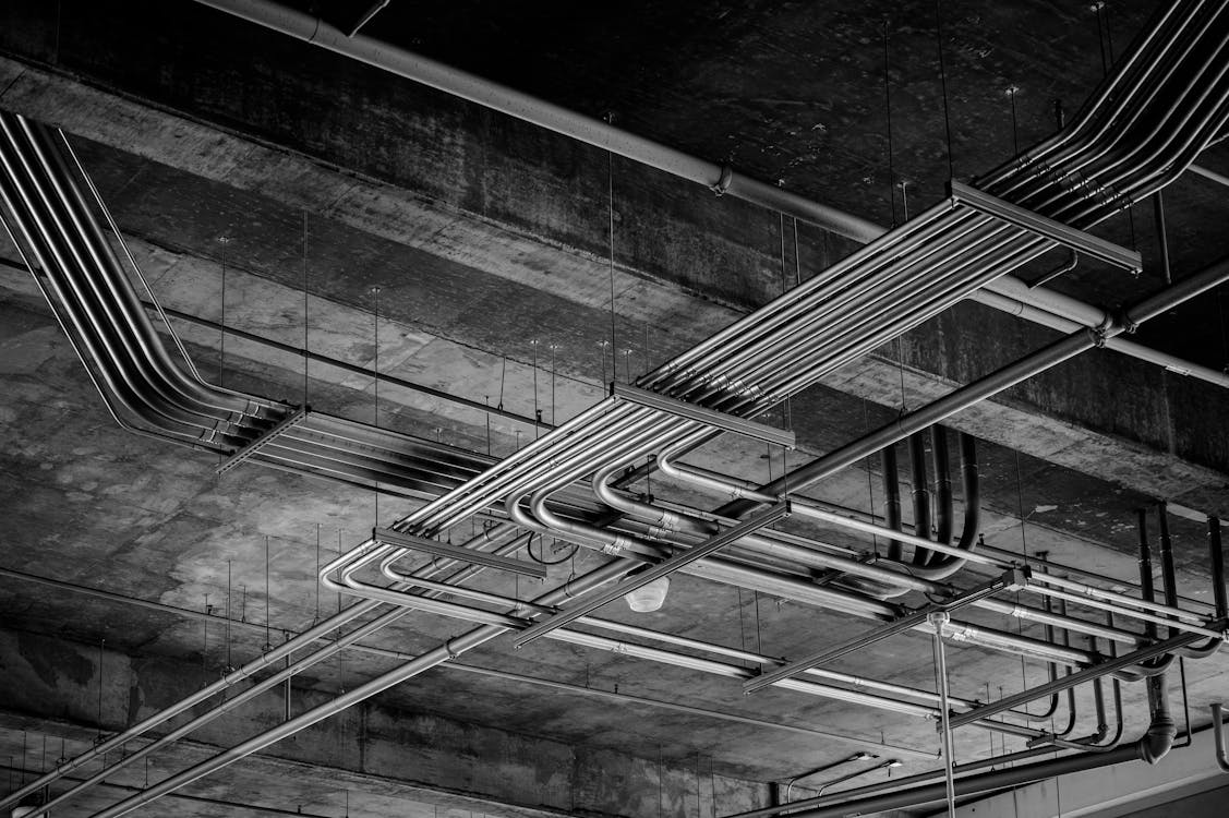 Black and white photo of pipes in a building