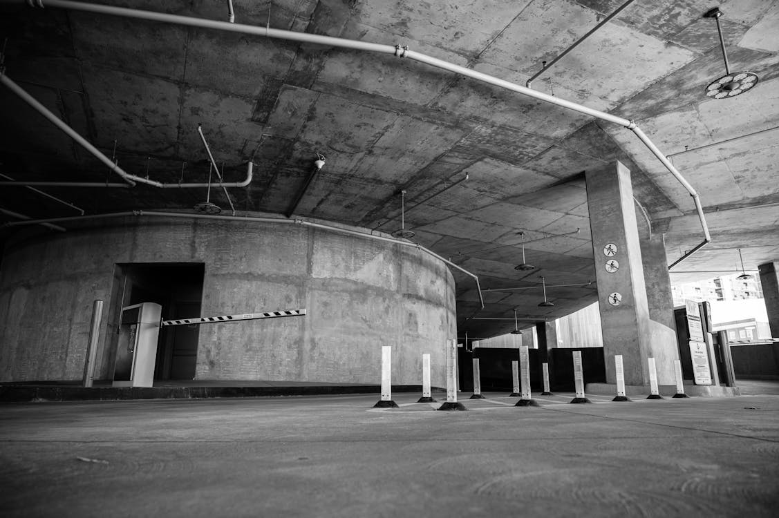 A black and white photo of an empty parking lot