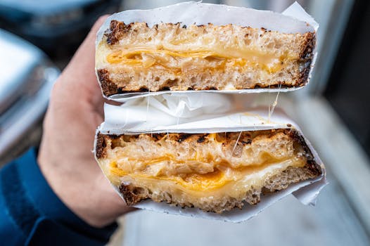 Satisfying close-up of a freshly prepared grilled cheese sandwich with melted cheese.